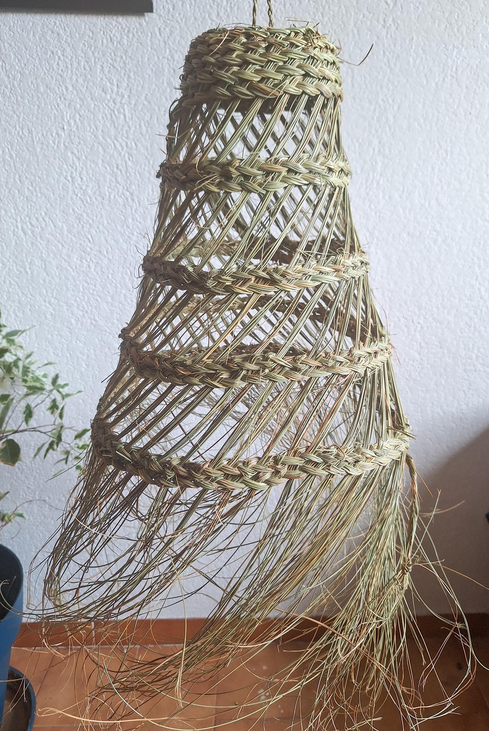 Openwork conical palm leaf pendant light