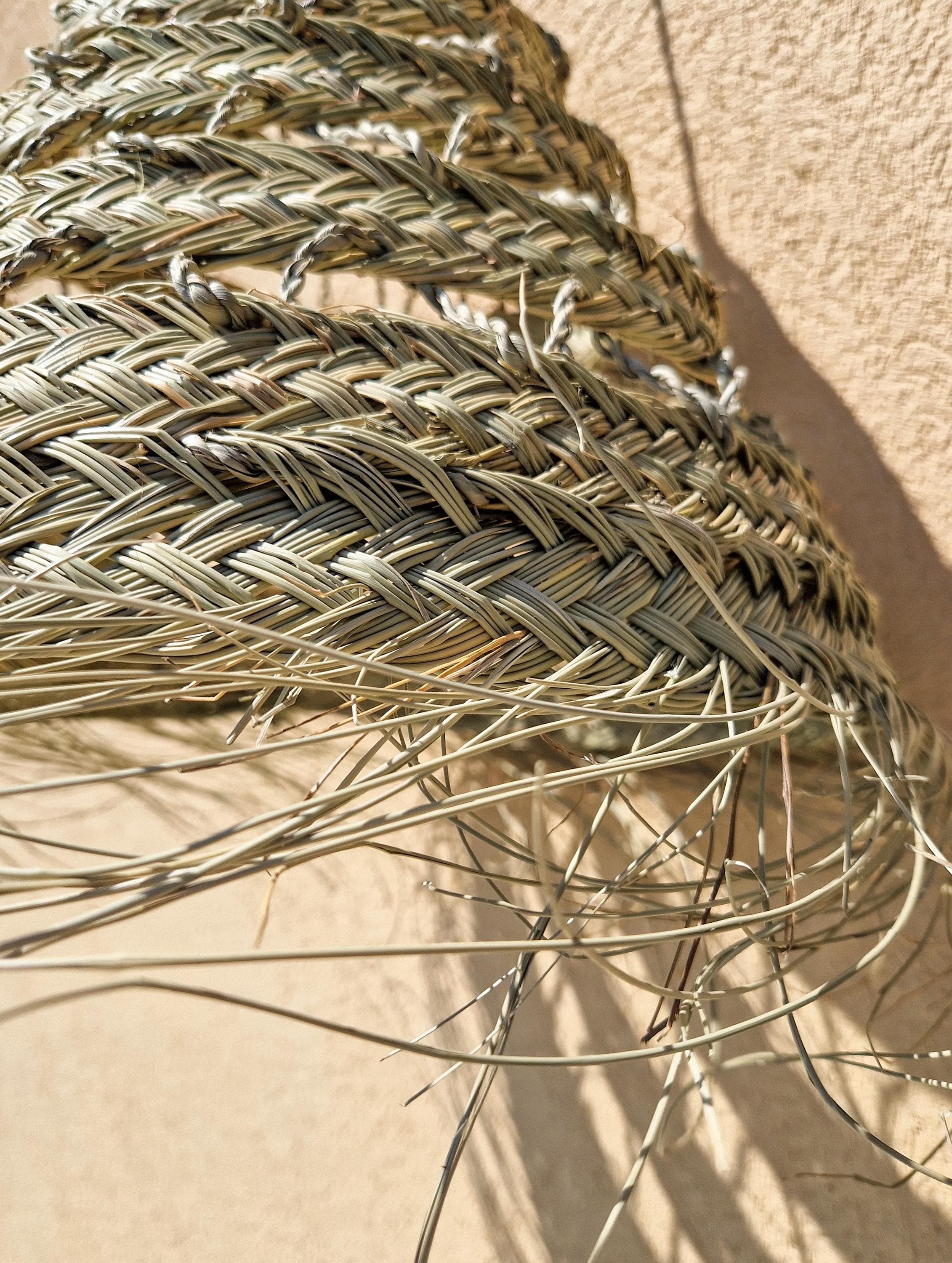 Suspension ajourée en feuille de palmier