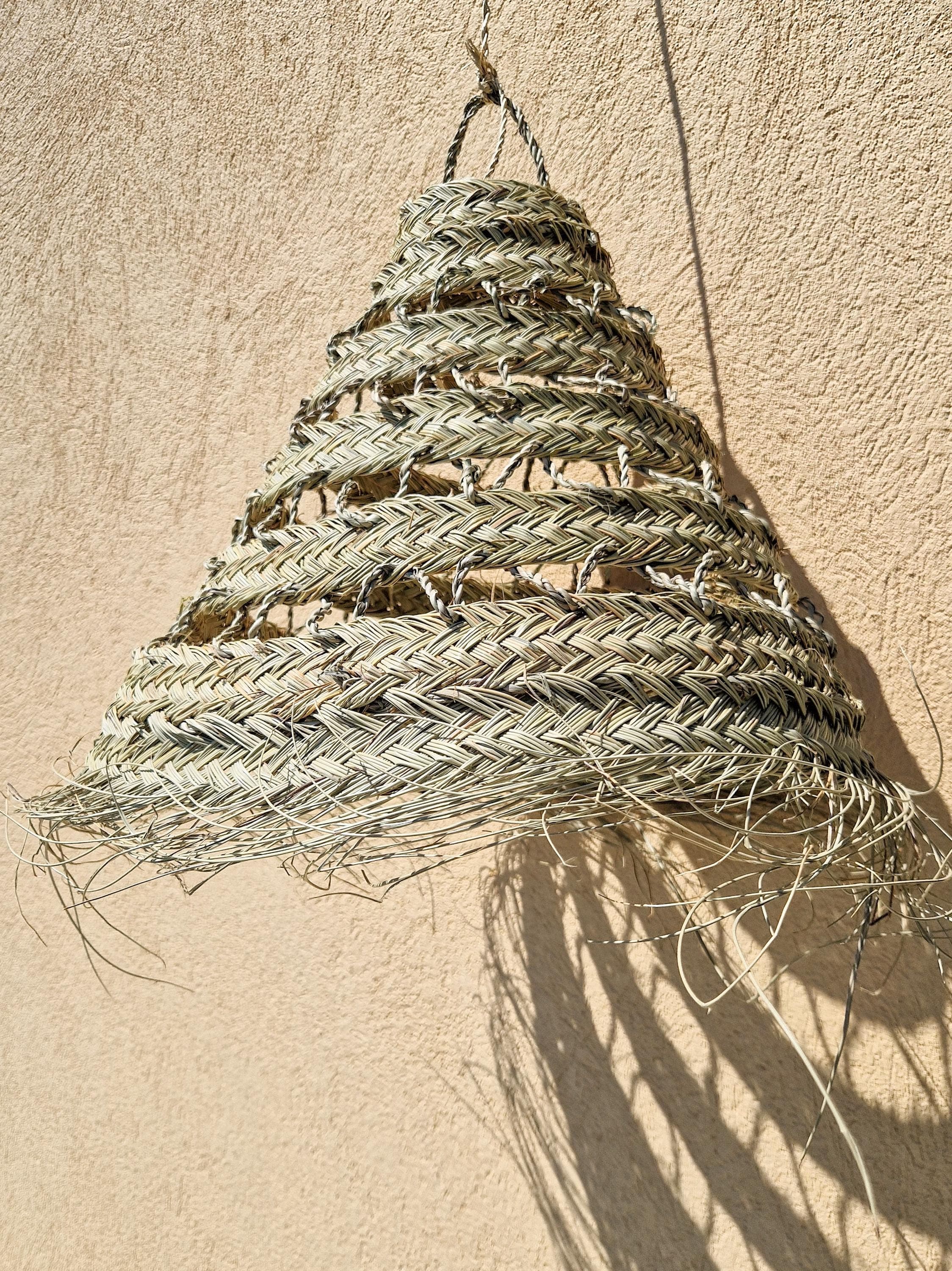 Suspension ajourée en feuille de palmier