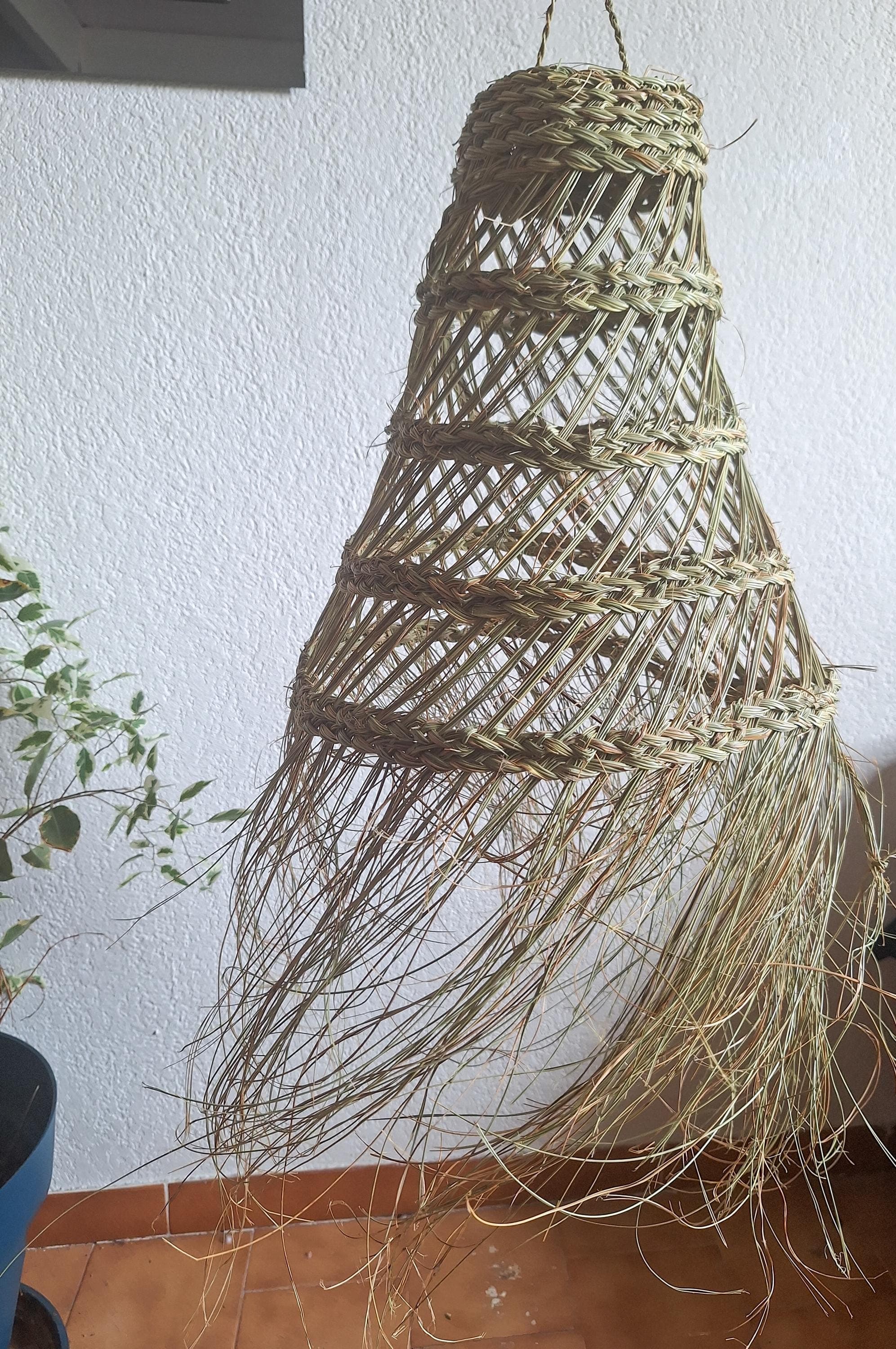 Openwork conical palm leaf pendant light