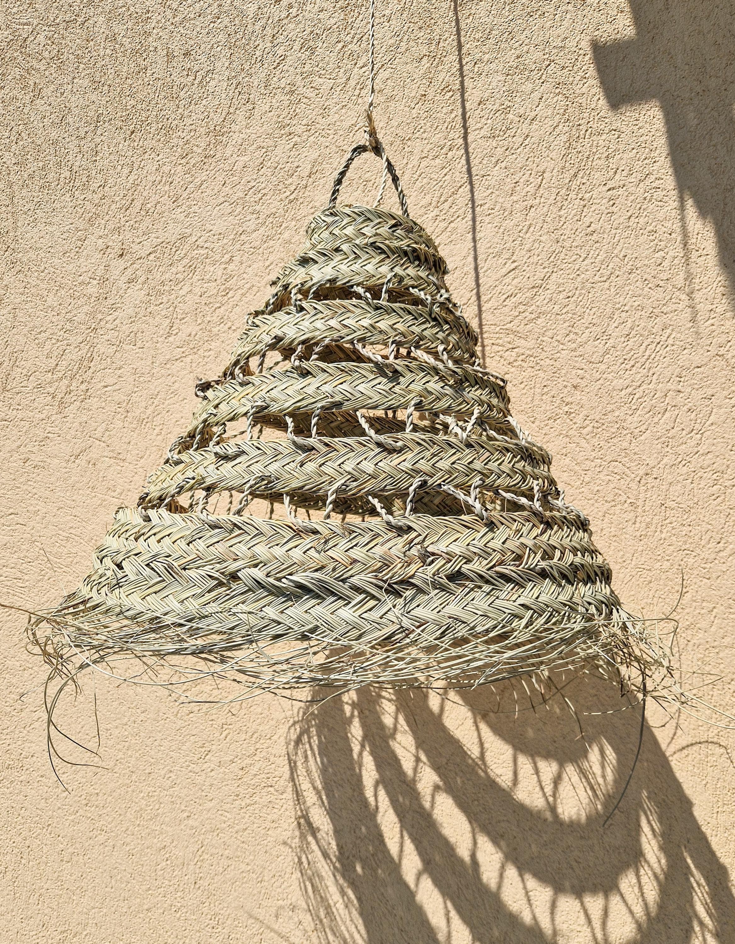 Suspension ajourée en feuille de palmier