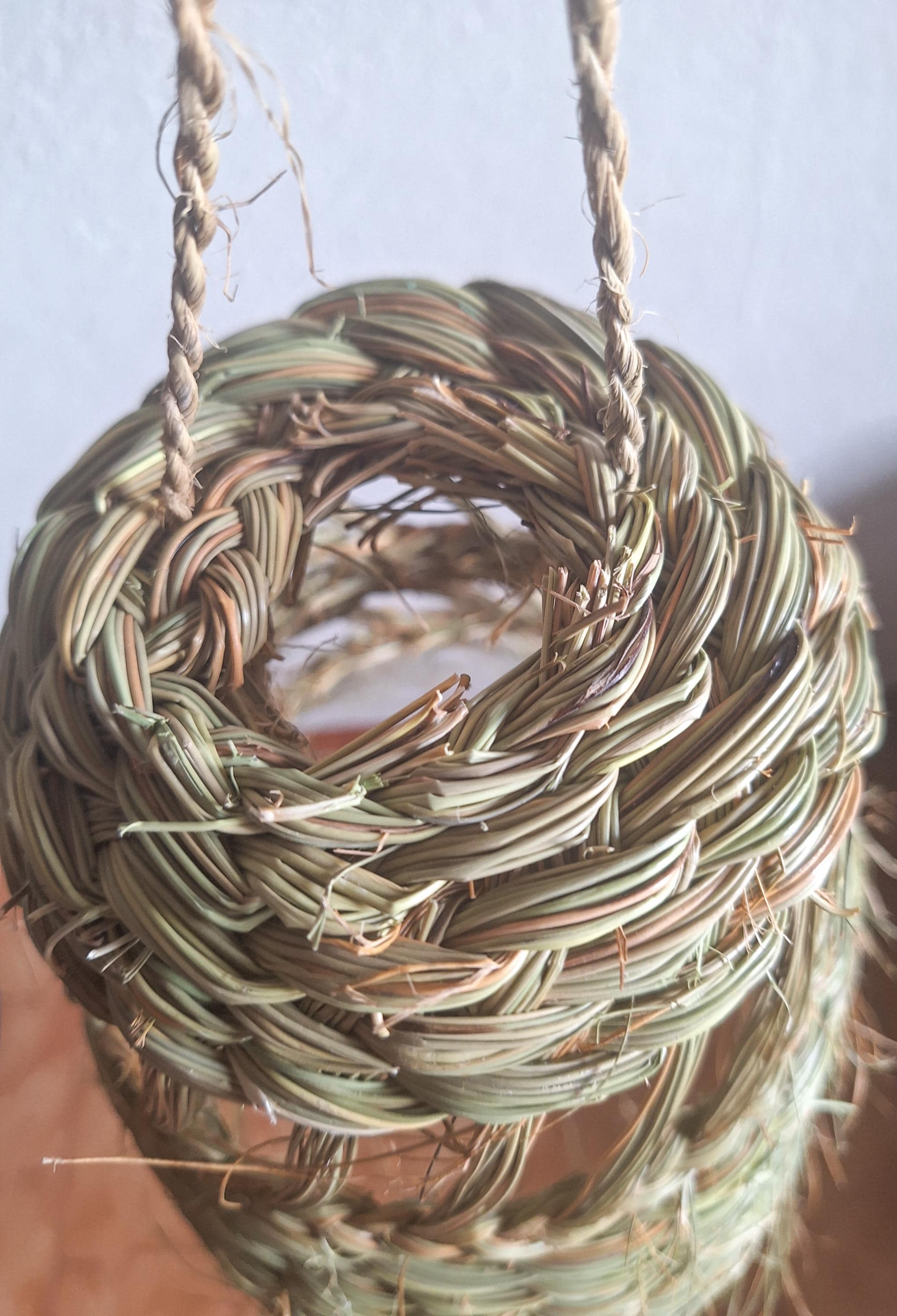 Openwork conical straw pendant light