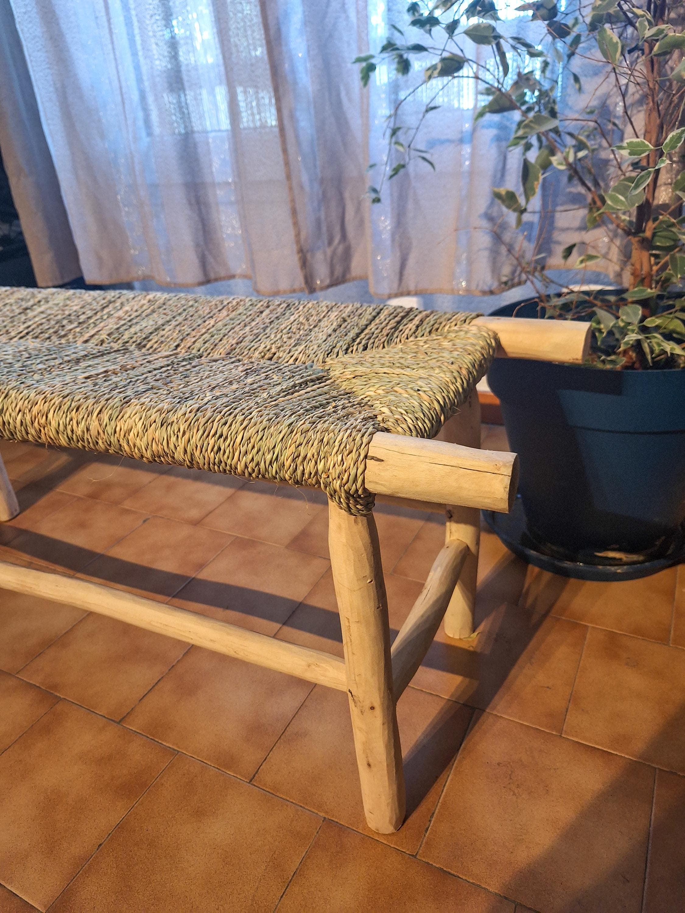 Wooden bench and natural palm leaf rope