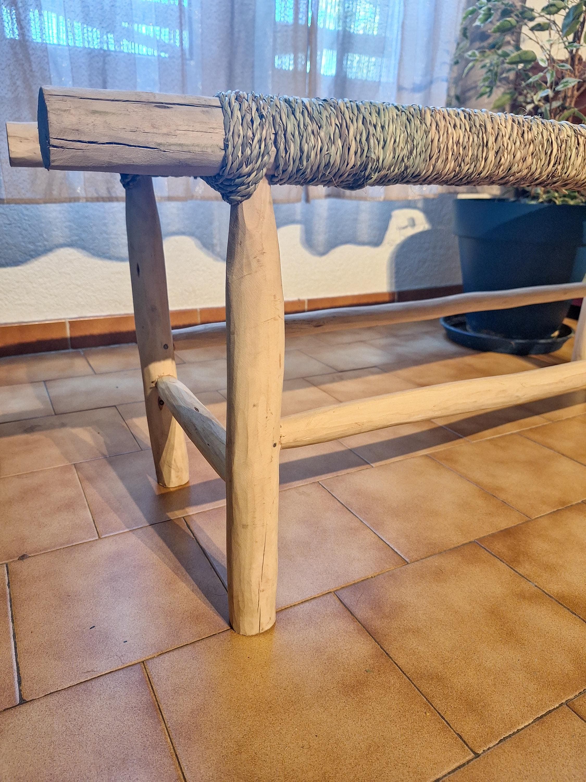 Wooden bench and natural palm leaf rope