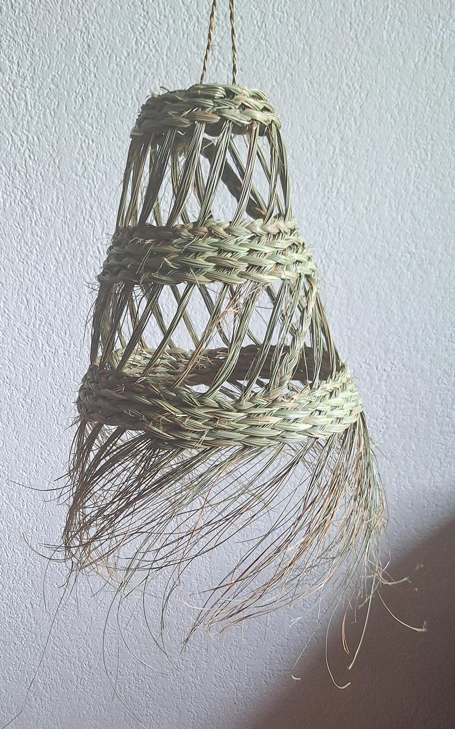 Openwork conical straw pendant light