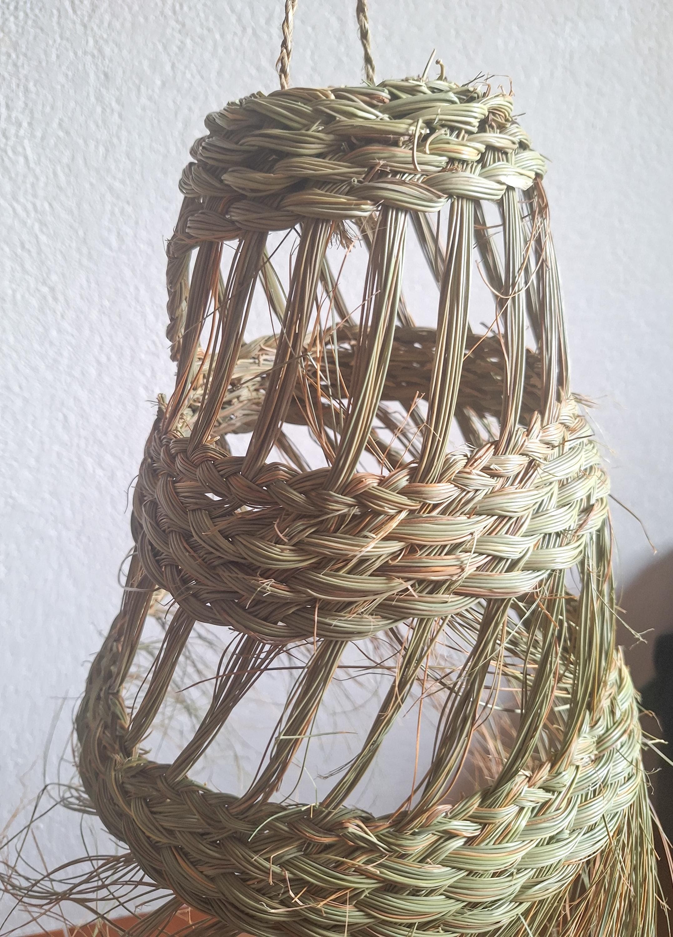 Openwork conical straw pendant light