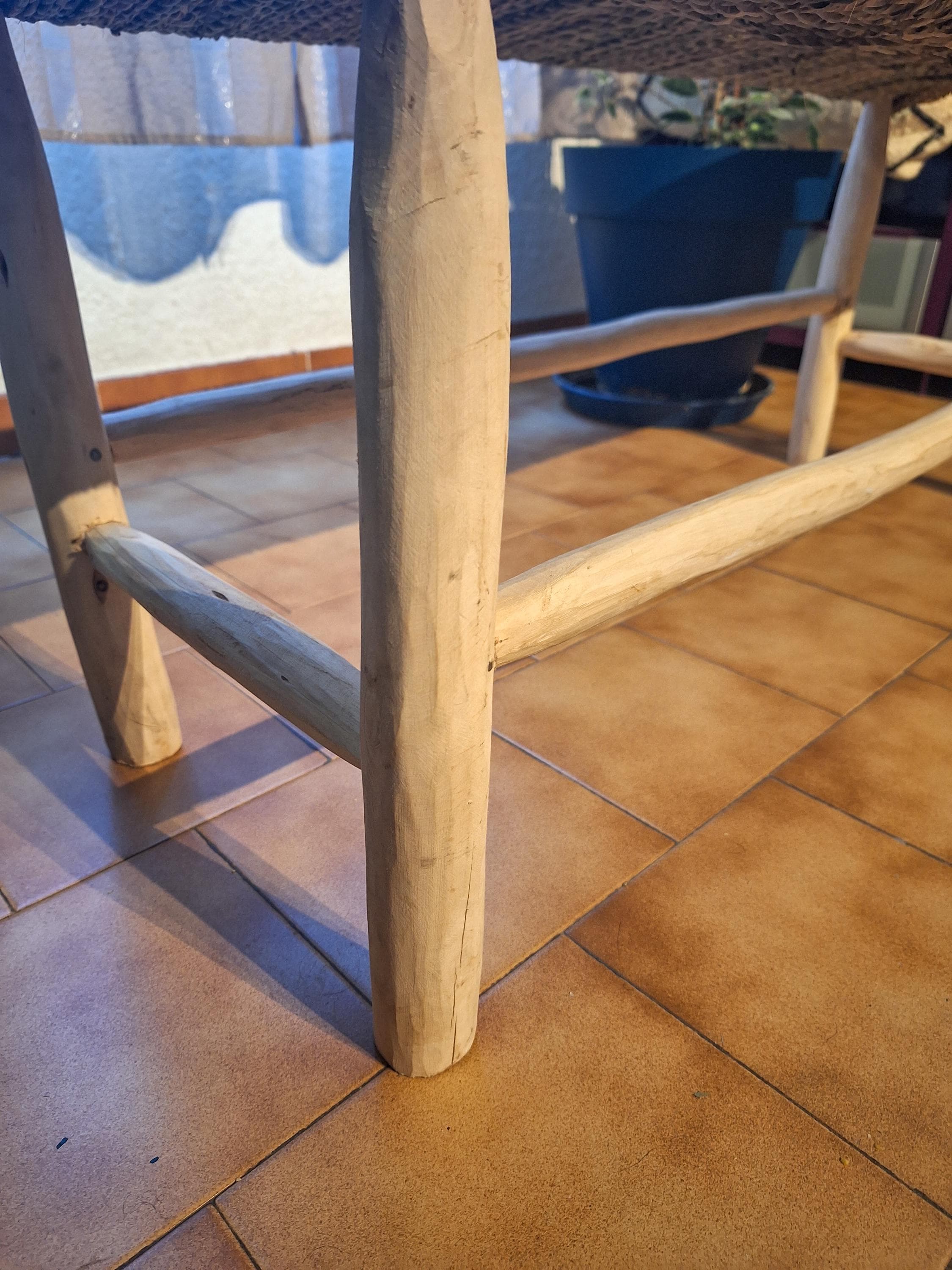 Wooden bench and natural palm leaf rope