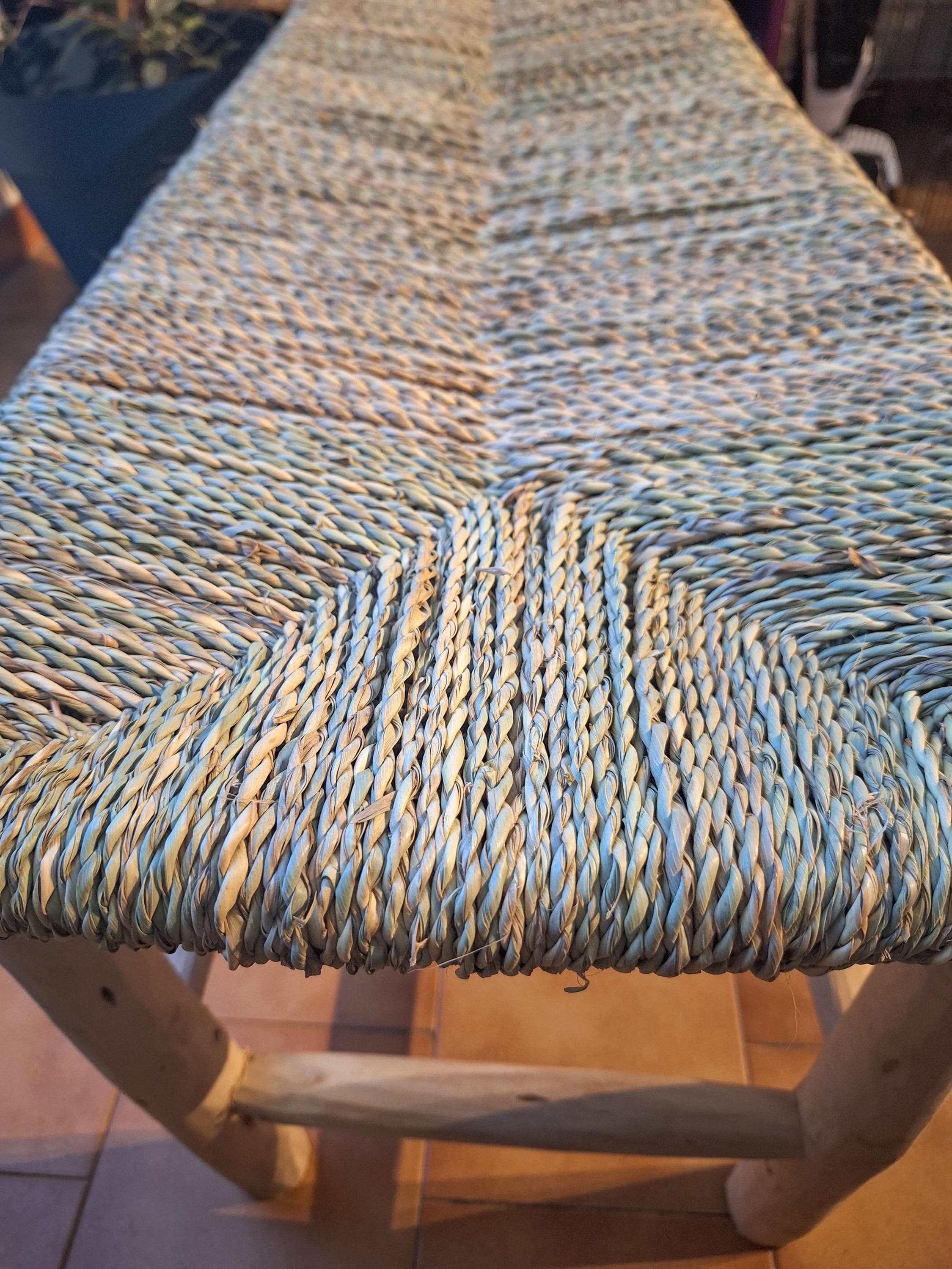 Wooden bench and natural palm leaf rope