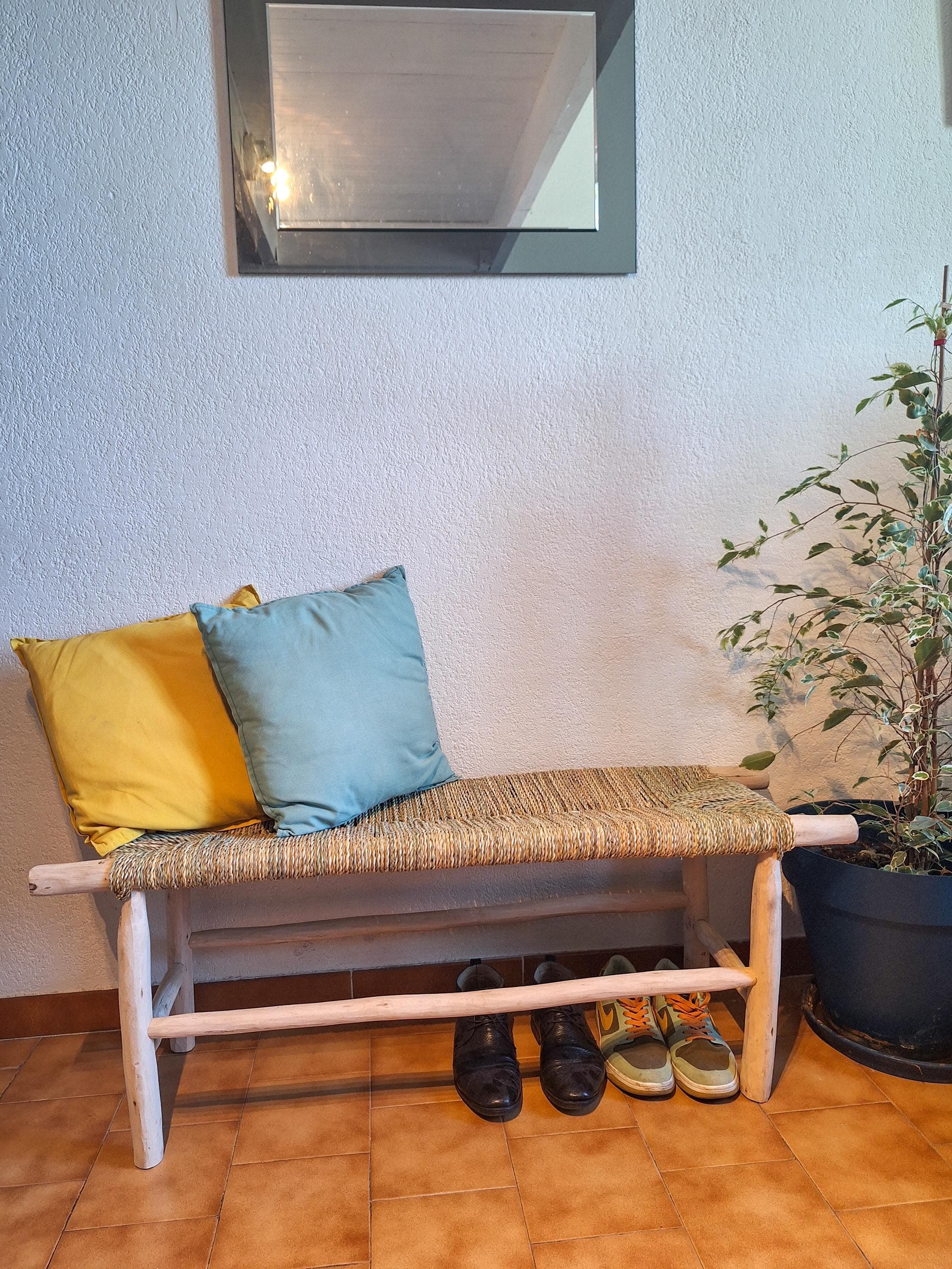 Wooden bench and natural palm leaf rope