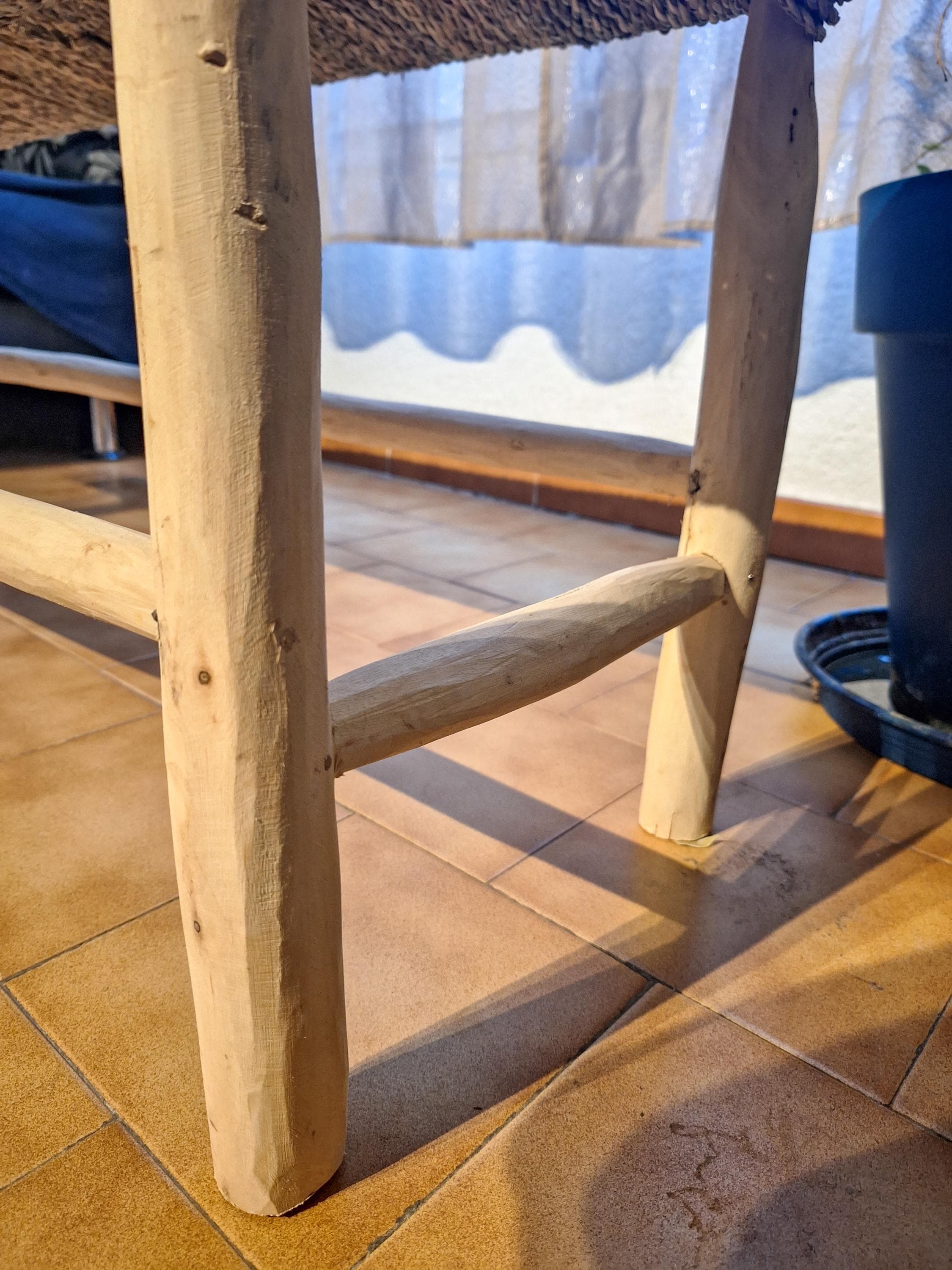 Wooden bench and natural palm leaf rope