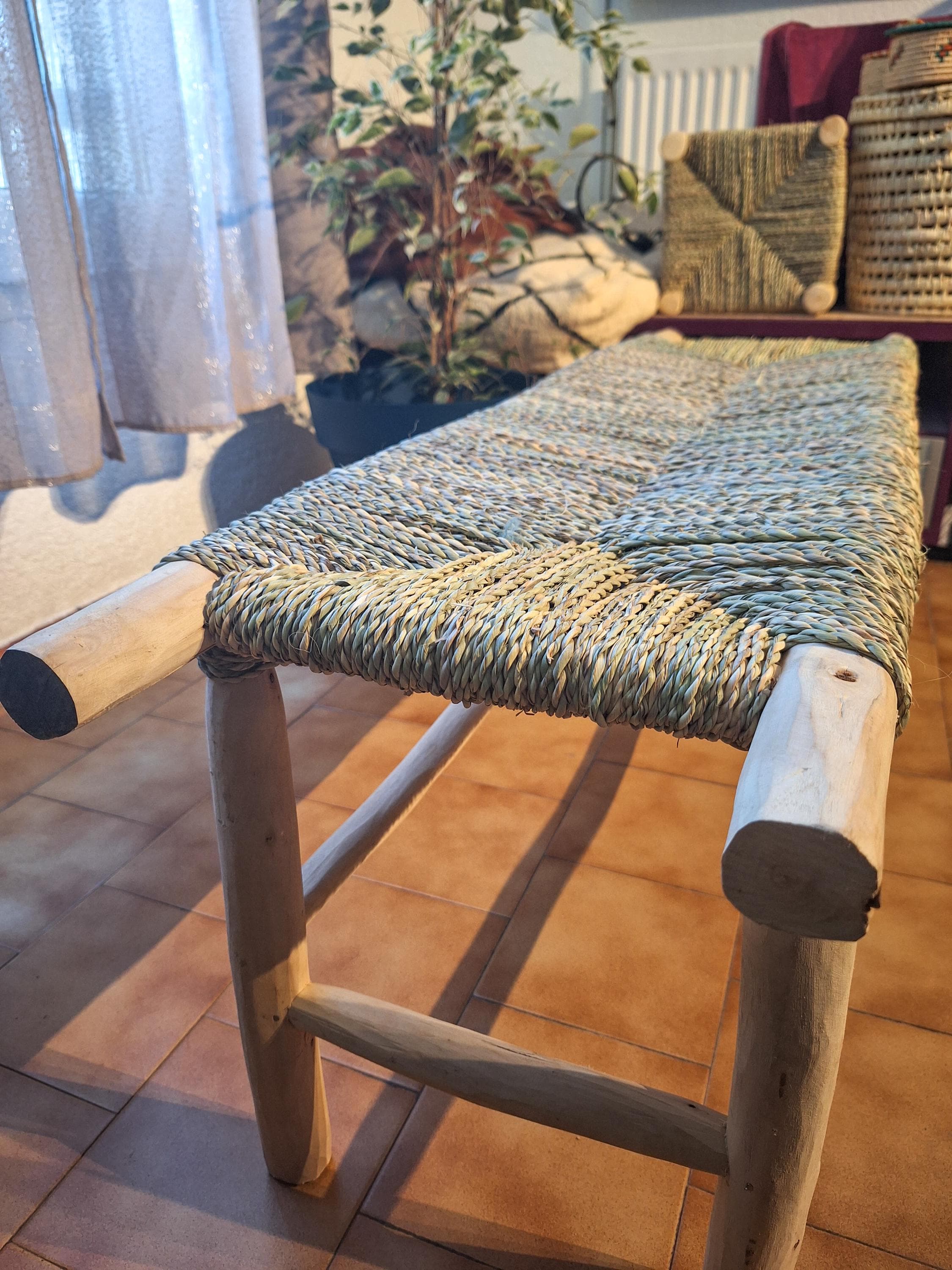 Wooden bench and natural palm leaf rope