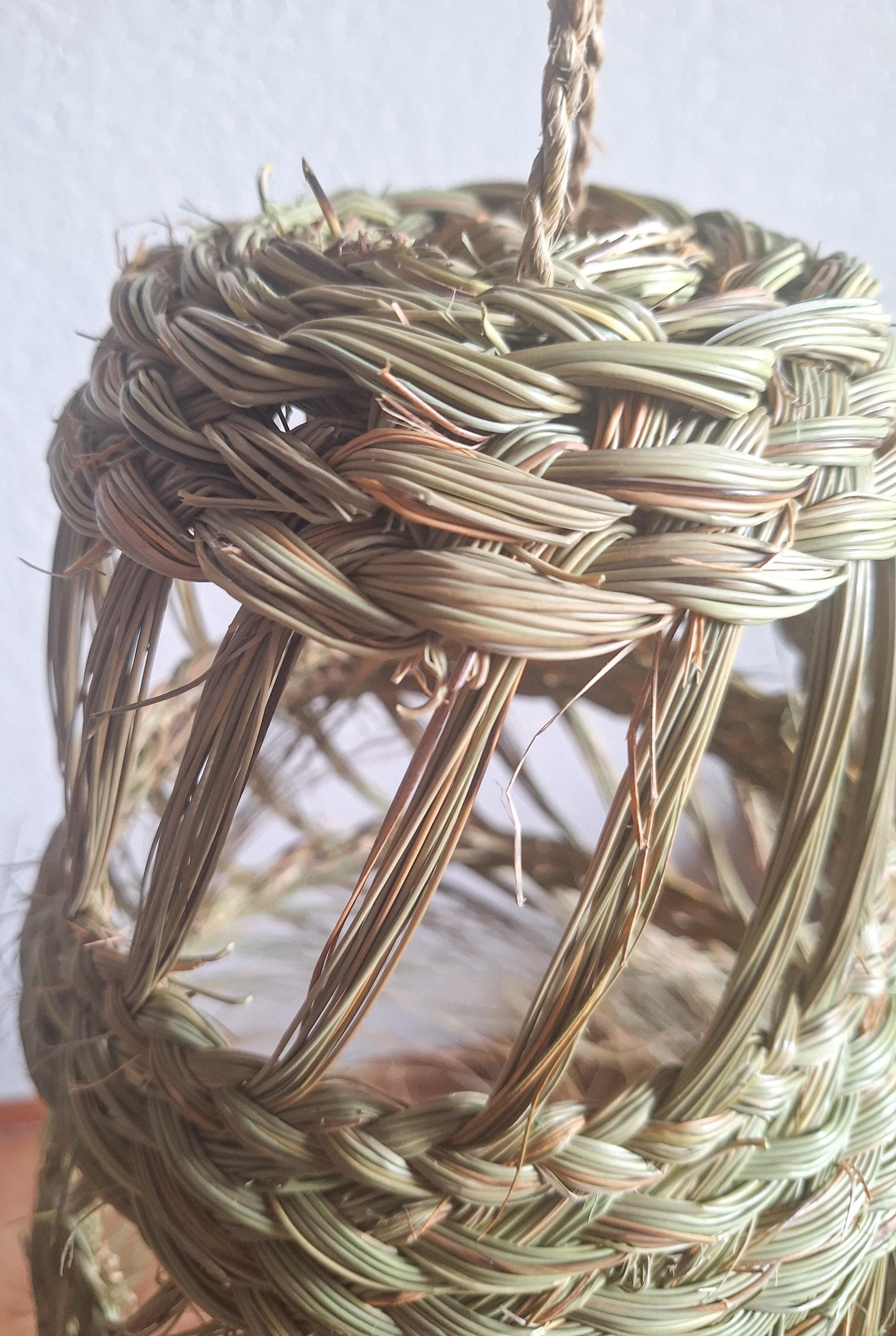 Openwork conical straw pendant light